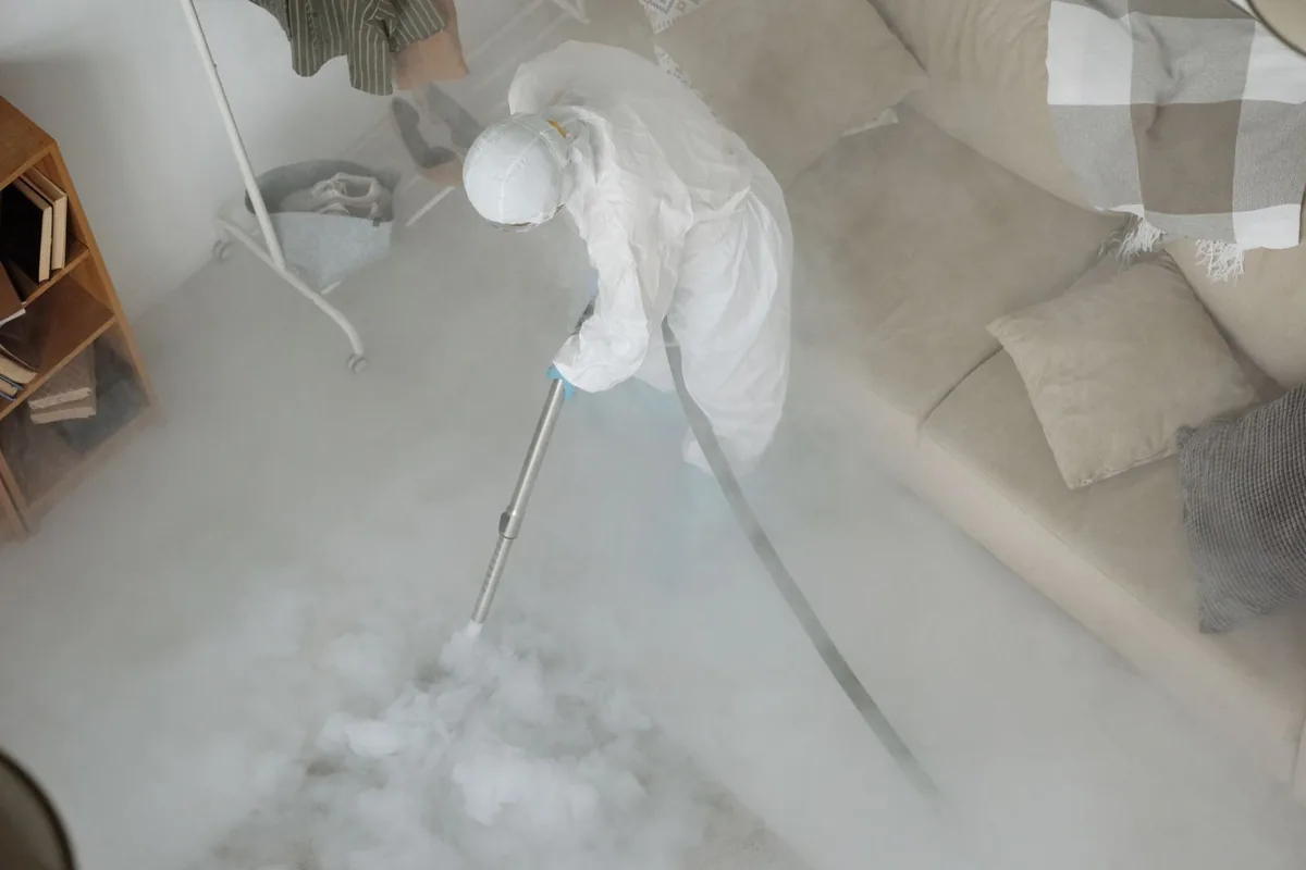 Biohazard cleanup technician in protective equipment, West Hempstead, NY
